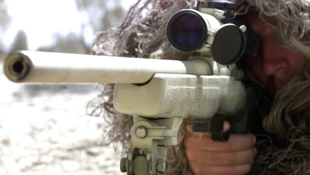 A Canadian sniper uses a C3A1 sniper rifle.