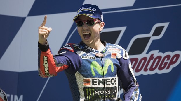 Winners are grinners: Yamaha's Jorge Lorenzo won the Italian grand prix with a last-gasp move against Marc Marquez.