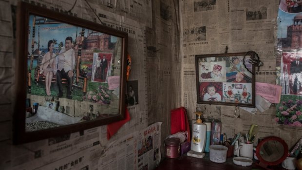 Pictures of President Xi Jinping with his wife, Peng Liyuan, are displayed in the home of Li Chao in Chashan, China.