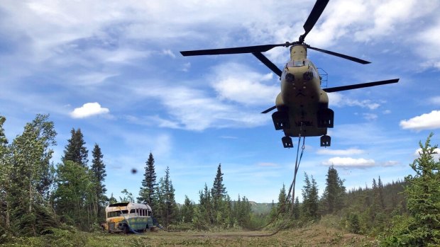 Alaska Army National Guard soldiers use a CH-47 Chinook helicopter to remove the abandoned bus.