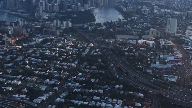Cars crawl along the Pacific Motorway after a breakdown on the Riverside Expressway