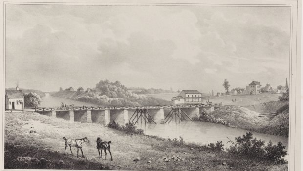 Lithograph of the Gaol Bridge in Parramatta in 1826. The horses are standing behind where the Riverside Theatre now is.The bridge was built on stone piers with timber railings. 