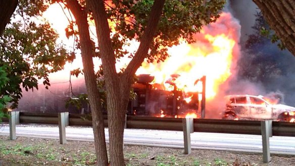 Fireball: The tanker lies on its side engulfed by flames.