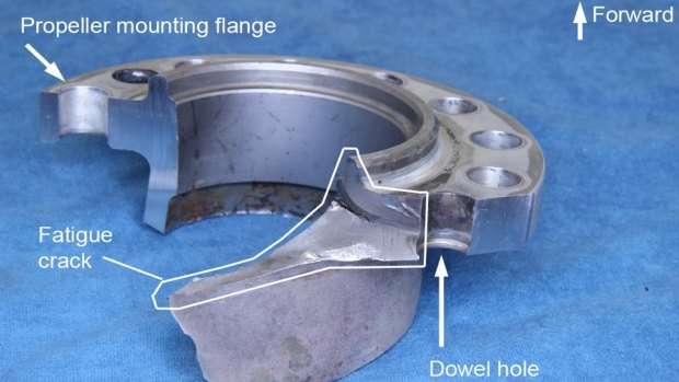 From the ATSB report: "Section of the propeller shaft showing the fatigue crack originating at the dowel hole and progressing into the shaft itself."