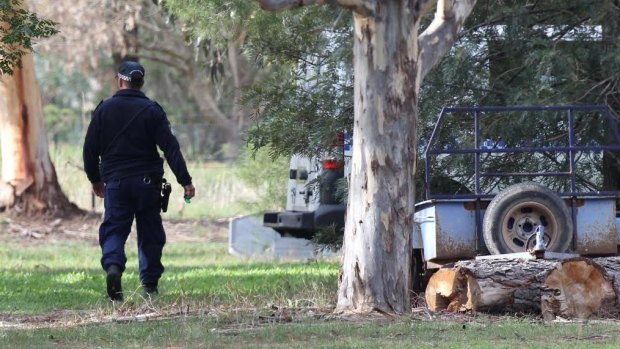 Scene of killing: Police attend the Springvale property after the death of Roger Clements.