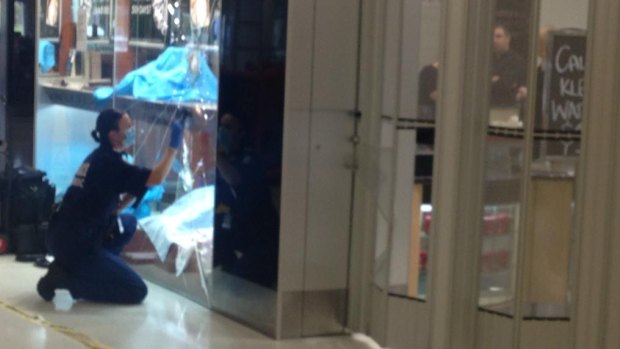 Forensic police at the Innaloo jewellery store raided by thieves.