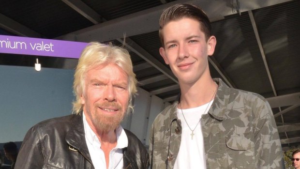 Jayden Seyfarth with Virgin Group owner Richard Branson two years ago after Seyfarth printed Branson's business class ticket and had the billionaire sign it.