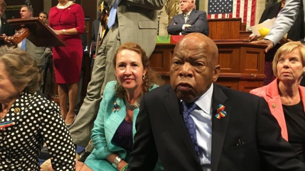 Democrat members of Congress including Representative John Lewis, centre, and Elizabeth Esty participate in a sit-in earlier this month to demand gun control legislation. 