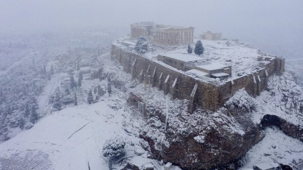 Snow covers the ancient Acropolis hill in Athens.
