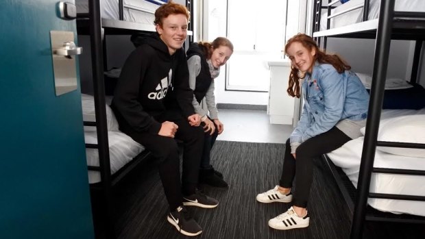Tom, Bella and Jess Collishaw in one of the rooms at new group accommodation centre Canberra Park, next to Exhibition Park.