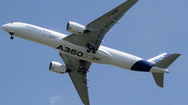 The Airbus A350 flies over Toulouse-Blagnac airport during its maiden flight in southwestern France.