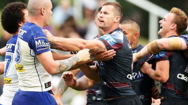 Players scuffle after David Klemmer of the Bulldogs slapped Daly Cherry-Evans of the Sea Eagles.