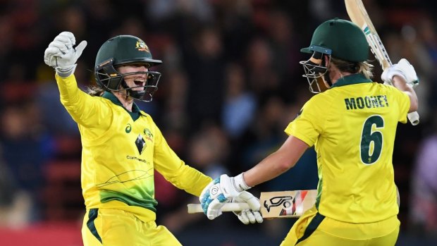 Getting the urn back: Beth Mooney and Rachael Haynes react after Mooney hit the winning runs.