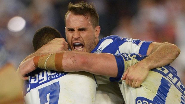 Bulldogs man: Five-eighth Josh Reynolds celebrates with teammates after kicking the winning field goal against the Dragons.