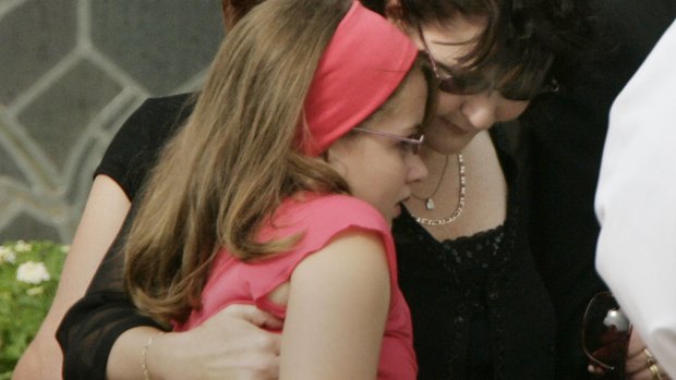 Monica-Rose is comforted by her mother, Jennie-May.