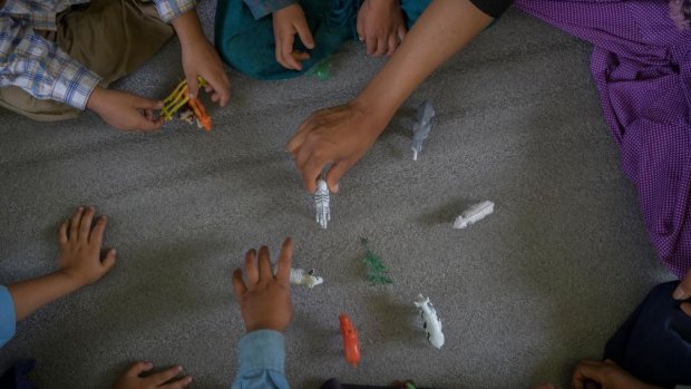 Nepali children play, but fears about health and housing still traumatise many.
