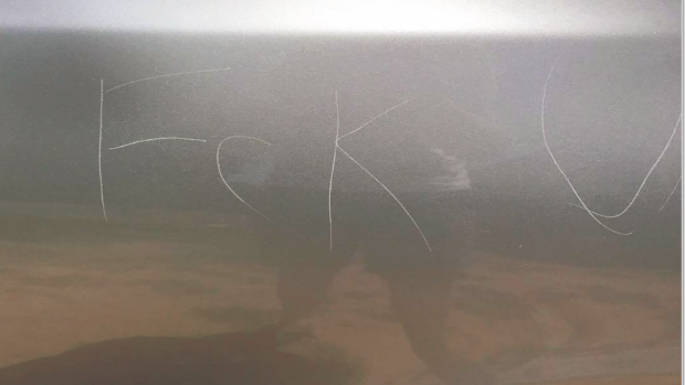 Jake Allert's vandalised car: he thinks a taxi driver who tried to take revenge on a fare evader could be to blame.
