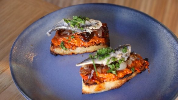 Anchovy, lardo and confit tomato on toast.