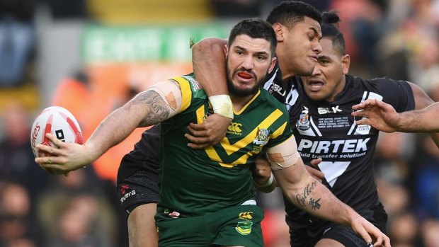 Matt Gillett tries to offload as he's tackled by New Zealand's David Fusitu'a in the Four Nations final at Anfield on Sunday.