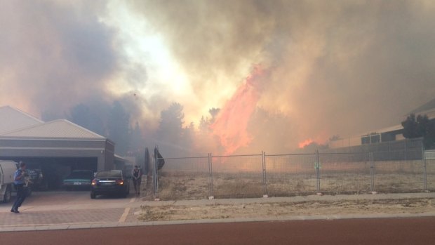 The fires take hold in Ellenbrook after an emergency warning was issued