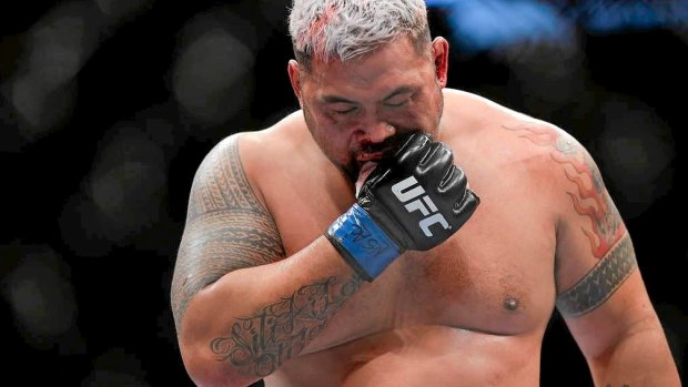 Mark Hunt removes his mouthpiece in between rounds at UFC 160 in Perth.