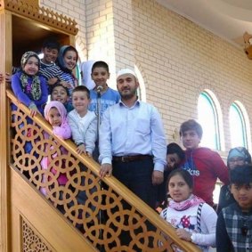 Sunshine Mosque imam Mustafa Asmaci with worshippers.