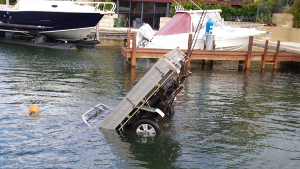 The ute being pulled from the water in Halls Head on Wednesday. 