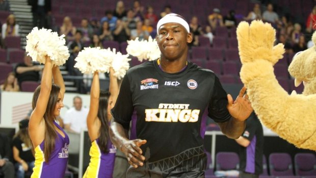 Plenty of NBA experience: Al Harrington is welcomed to the Kingdome by Sydney's cheerleaders and the Lion mascot.
