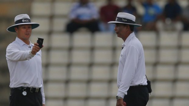 Umpires use a light meter at Kandy.