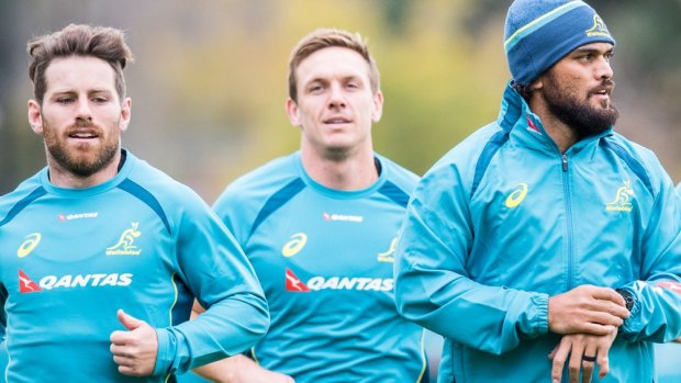 In the running: Dane Haylett-Petty (centre) trains with Wallabies teammates Bernard Foley (left) and Karmichael Hunt.