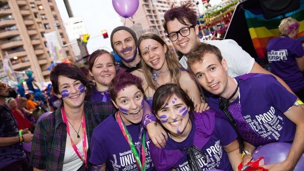 Students, police and the public celebrate Wear it Purple day in Sydney on Friday. 