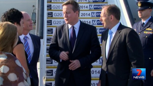 British Prime Minister David Cameron and his Australian counterpart Tony Abbott meet with Queensland Premier Campbell Newman at Brisbane Airport.