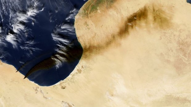 Smoke blowing north-east from Libyan oil terminals – visible as two small wedges on the lower left-side of image – on Wednesday.