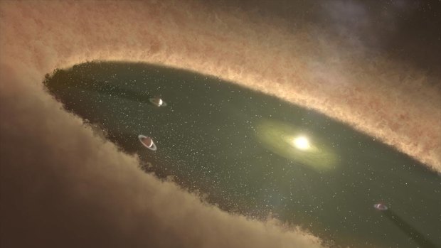 An artist's impression of the planetary system in the making.