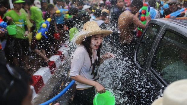 Tourists and Thai residents take part in a city-wide water fight during Thai New Year celebrations in Chiang Mai in 2014. Sometimes revellers get out of hand.