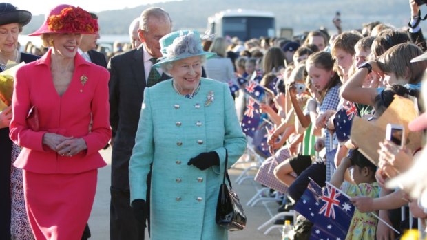 Her Majesty the Queen, centre, does a walkabout with Governor-General Quentin Bryce and his Royal Highness The Duke of Edinburgh at her arrival in Canberra on October 19, 2011.