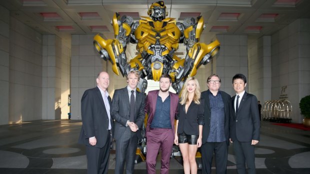 Public relations ... (L-R) Vice chairman of Paramount Rob Moore, director Michael Bay, Jack Reynor, Nicola Peltz, producer Lorenzo di Bonaventura and Pangu Hotel general manager Norman Song in Beijing, China.