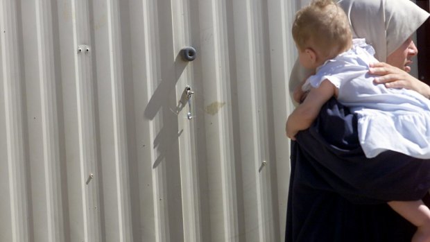 Children are being born and spending extended periods of time in detention, the Ombudsman has warned. 