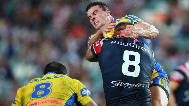 Hard knocks: Jared Waerea-Hargreaves cops a high shot from Parramatta's Darcy Lussick during the Roosters' big win on Saturday.