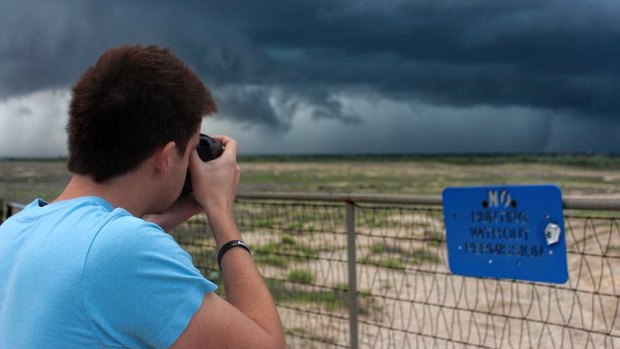 James photographing a storm earlier this year.