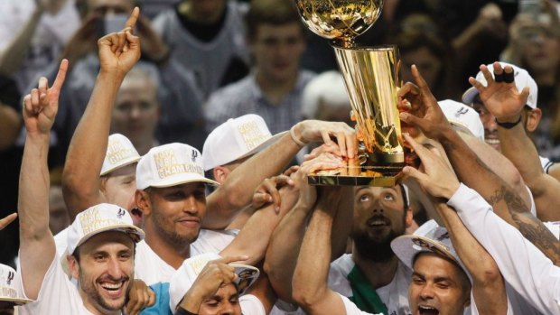 Champions: San Antonio with the Larry O'Brien trophy.