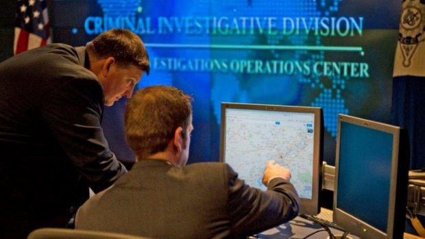 Agents at work in the US Secret Service's Criminal Investigative Division Operations Centre in Washington, DC.
