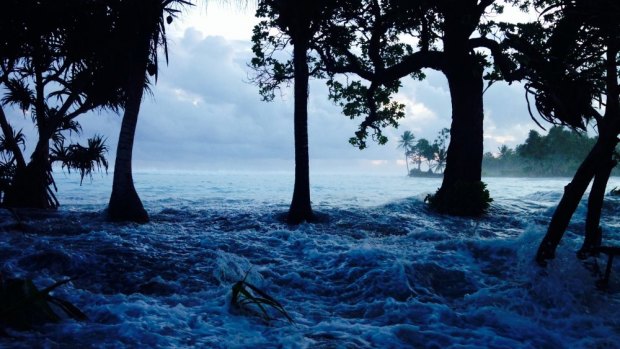 The Marshall Islands hit by king tides. It is one of the South Pacific nations researchers say are facing unaffordable costs to protect their coastal buildings.
