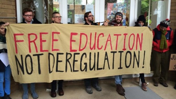 Activists protest against Julie Bishop's lecture at the Australian National University.