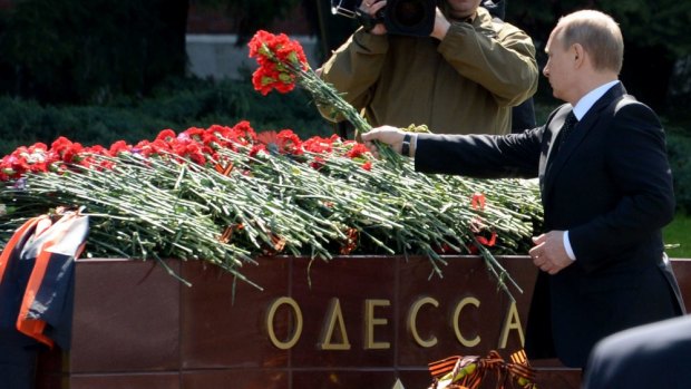 Rival claims: Russian President Vladimir Putin lays flowers at a Moscow memorial to Odessa's role in World War II.
