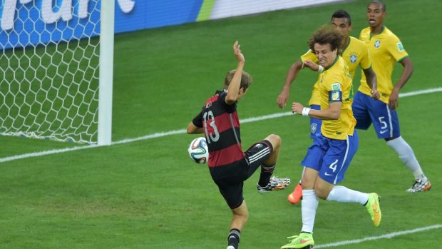 The beginning of the end: An unmarked Thomas Mueller scores Germany's first goal in the 11th minute of the semi-final against Brazil. Eighteen minutes later, the score was 5-0.