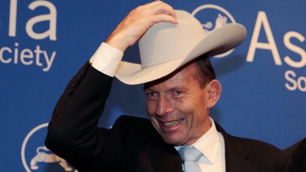 "Yee-ha!" Prime Minister Tony Abbott was presented with a Stetson and made an honorary guest of Texas when he spoke at the Asia Society in Houston last Friday.