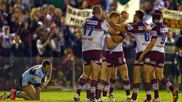 Tom Symonds is congratulated after splitting the Cronulla defence to score.
