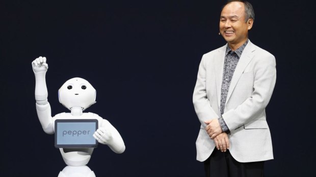 Softbank's Masayoshi Son with emotion-deciphering robot Pepper. 