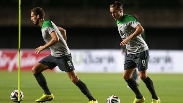 Matthew Spiranovic and Adam Taggart during a training session at Pituacu Stadium in Salvador on Thursday.